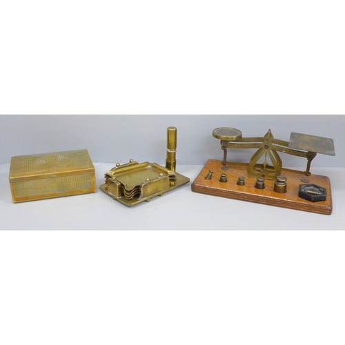 640 - A set of postal scales, a brass ashtray stand and a brass cigarette box