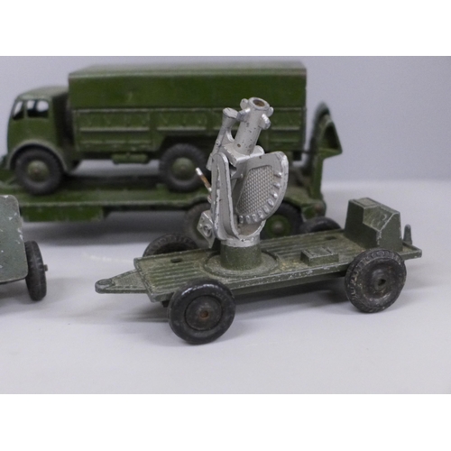 645 - A collection of Dinky Supertoys; Tank transporter 660, tank 651, 10 ton army truck 522 and four Lone... 