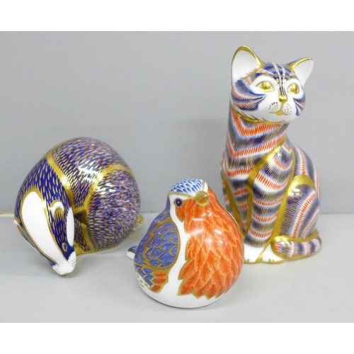 652B - Three Royal Crown Derby paperweights with silver stoppers; cat, badger and robin