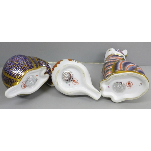 652B - Three Royal Crown Derby paperweights with silver stoppers; cat, badger and robin