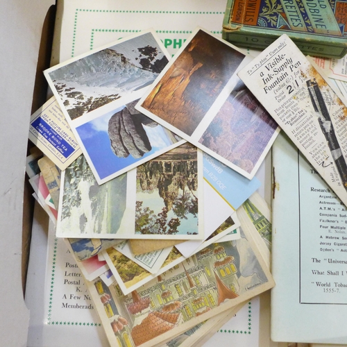 654 - A group of cigarette card pricing books, etc.