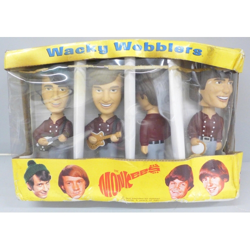 691 - A set of Funko The Monkees Wacky Wobblers, boxed (produced circa 2002)