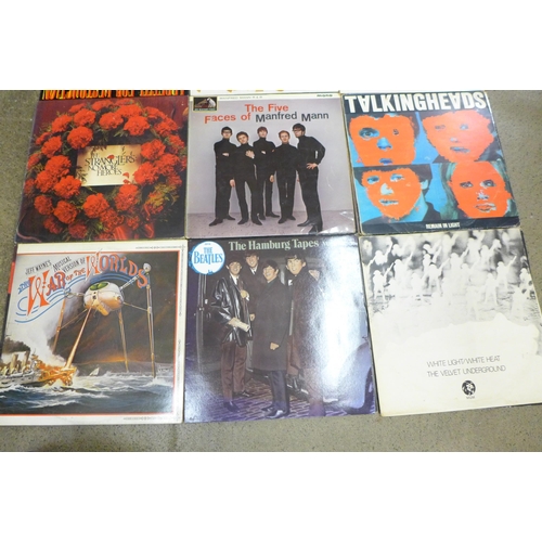 693 - Fifteen LP records including Guns N' Roses, Queen, Pink Floyd, Manfred Mann, The Stranglers, etc.