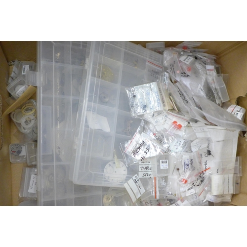 713 - A box of mixed watch parts, movements, etc.