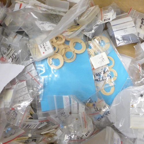 713 - A box of mixed watch parts, movements, etc.