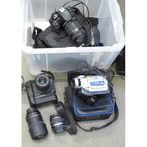 715 - A Canon EOS 40D camera with winder, Canon EOS 1000D camera, a Nikon AF-S Nikkor 55-300mm 1:4.5-1:3.5... 