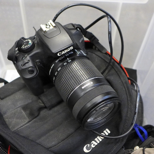 715 - A Canon EOS 40D camera with winder, Canon EOS 1000D camera, a Nikon AF-S Nikkor 55-300mm 1:4.5-1:3.5... 