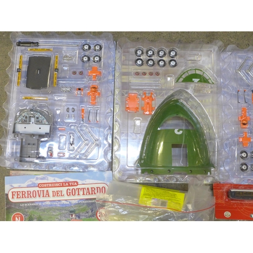 729 - De Agostini publication model parts, assorted including Millenium Falcon Rossi motorbike, Thunderbir... 