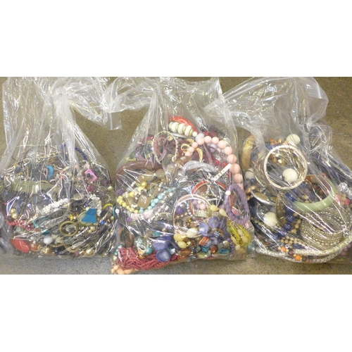 730 - Three large bags of costume jewellery