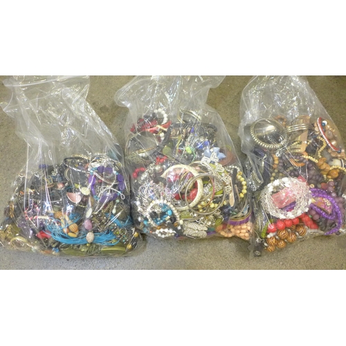 730 - Three large bags of costume jewellery