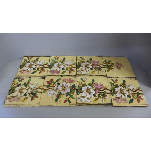 769 - Two sets of five Victorian fireplace tiles (forms a picture of flowers) and one larger tile