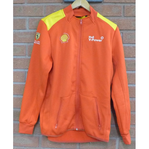 773 - Three jackets; Isle of Man TT jacket (ladies large), a Shell Ferrari partners jacket and a sheepskin... 