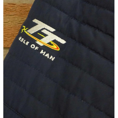 773 - Three jackets; Isle of Man TT jacket (ladies large), a Shell Ferrari partners jacket and a sheepskin... 