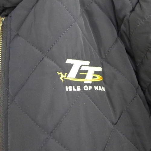 773 - Three jackets; Isle of Man TT jacket (ladies large), a Shell Ferrari partners jacket and a sheepskin... 