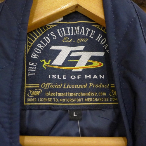 773 - Three jackets; Isle of Man TT jacket (ladies large), a Shell Ferrari partners jacket and a sheepskin... 