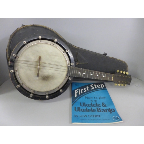 783 - A cased banjo