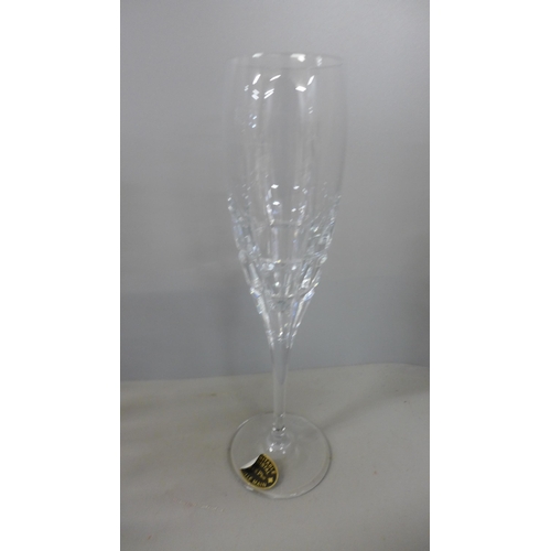 794 - A heavy crystal glass champagne chiller and two boxed sets of six crystal champagne glasses, 24% Pb0... 