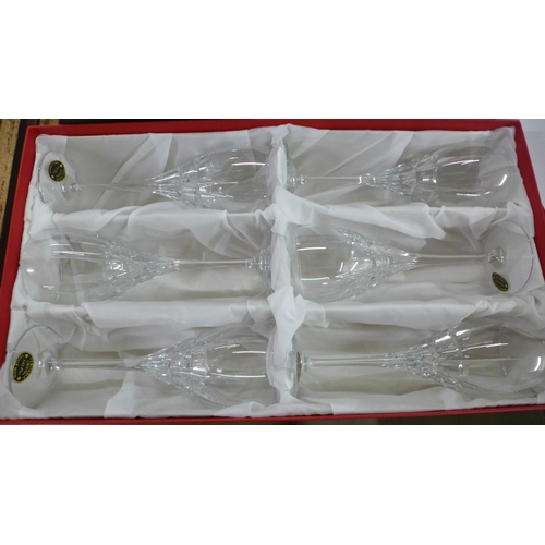 794 - A heavy crystal glass champagne chiller and two boxed sets of six crystal champagne glasses, 24% Pb0... 