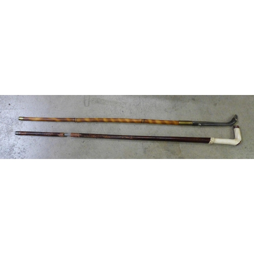 801 - Two sword sticks, one with bone handle, a/f and one with horn handle and bird's head top **PLEASE NO... 