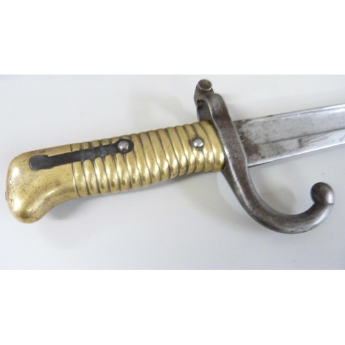 811 - A large French bayonet, dated 1871, T54148, number on scabbard worn but does match the bayonet **PLE... 