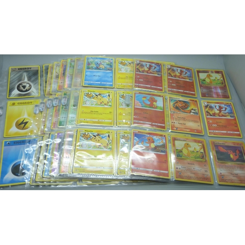 818 - Pokemon; part set XY Evolution including Holo, also Charmander and Pikachu