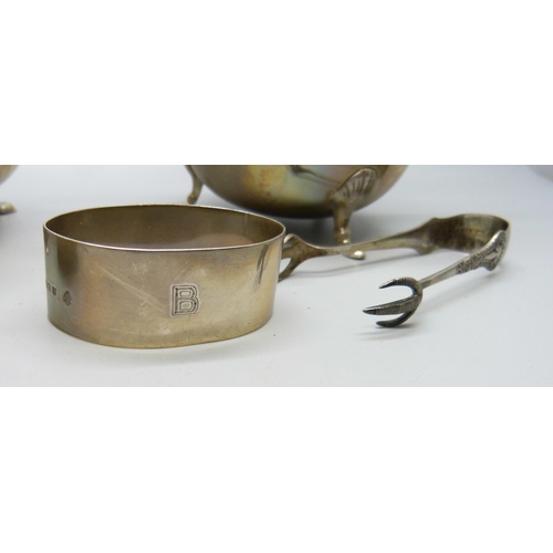 831 - A silver cream jug and sugar, two silver napkin rings, one in the form of a duck and a pair of silve... 