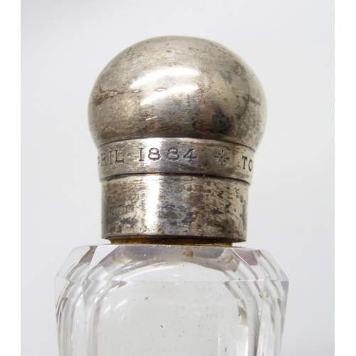 855 - A Victorian silver topped glass scent bottle, bears inscription dated 1884