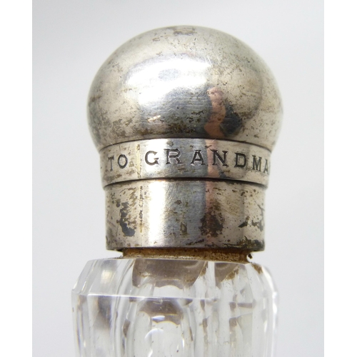 855 - A Victorian silver topped glass scent bottle, bears inscription dated 1884