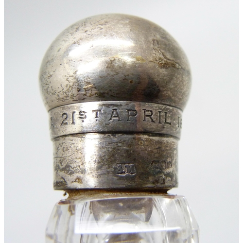 855 - A Victorian silver topped glass scent bottle, bears inscription dated 1884