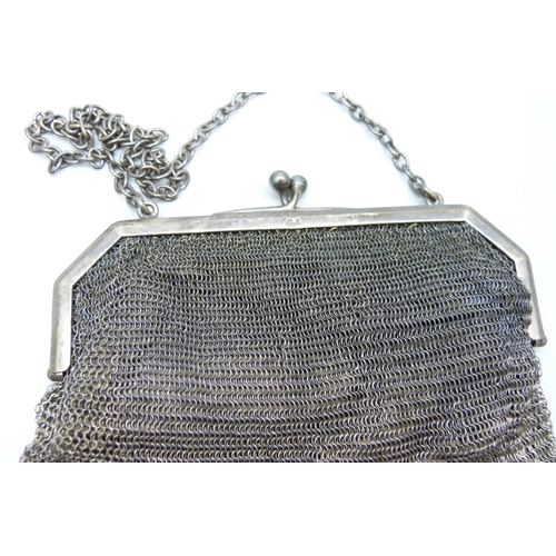 856 - A hallmarked silver mesh purse, 170g with liner