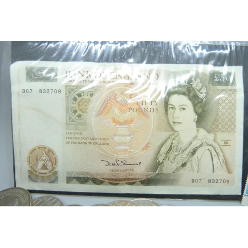 866 - A Bank of England £50 note, Somerset chief cashier, eleven £5 coins and a small collection of stamps