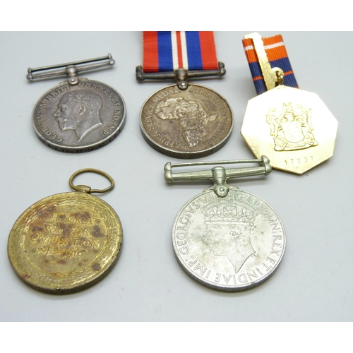 875 - Five assorted medals, WWI Victory medal to 2094 W.I. Morris RA, a WWI  British War medal to Sjt. N. ... 