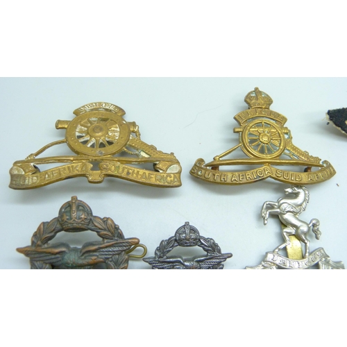 876 - Cap and other military badges, etc.