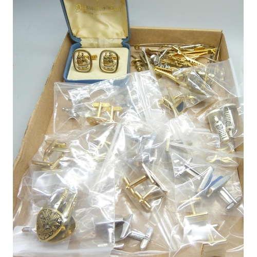 902 - Eighteen pairs of cufflinks and assorted tie-pins, etc.