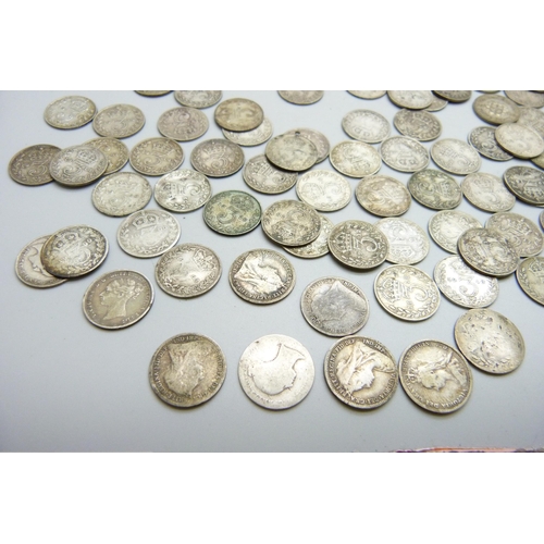 907 - A collection of British and foreign coins; one pound and ten shillings bank notes, 147g of pre 1920 ... 