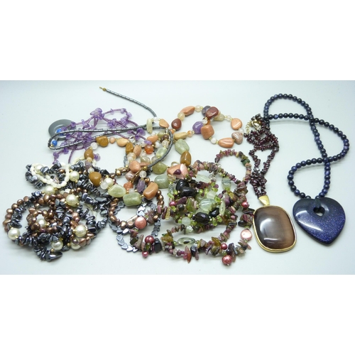 918 - A collection of gemstone jewellery including blue goldstone and amethyst