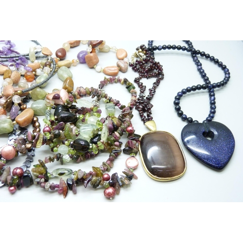 918 - A collection of gemstone jewellery including blue goldstone and amethyst