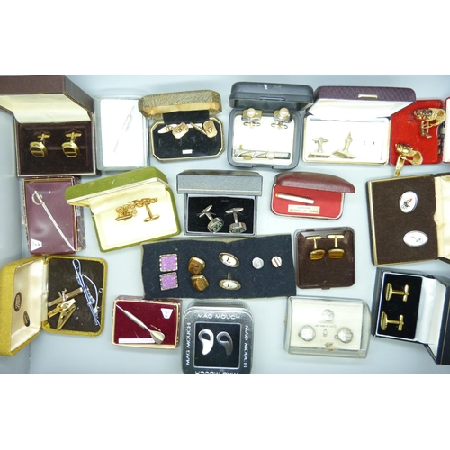 919 - A collection of boxed cufflinks and tie-pins