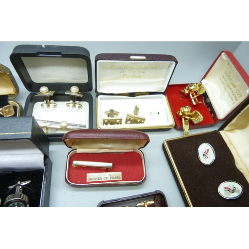 919 - A collection of boxed cufflinks and tie-pins