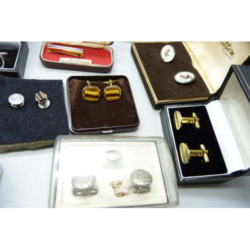 919 - A collection of boxed cufflinks and tie-pins