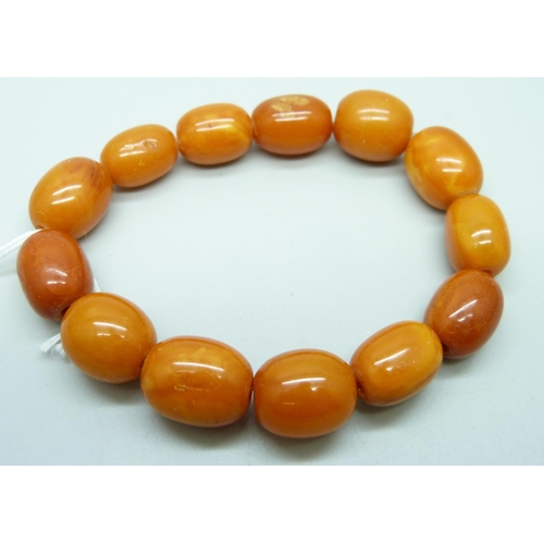 930 - A butterscotch amber bead bracelet, 19.5g