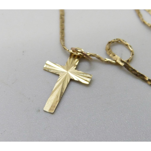 931 - A 14ct gold neck chain with a small cross pendant, 2.4g