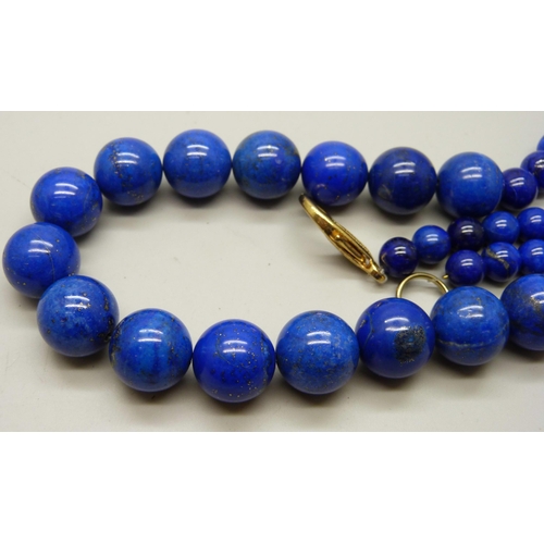 933 - A large and heavy lapis lazuli graduated bead necklace, 204g, 62cm