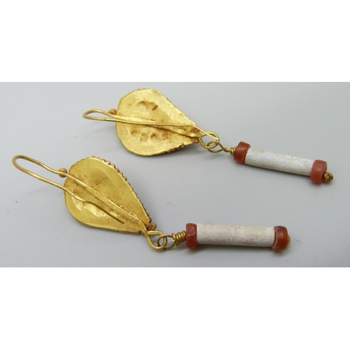 941 - A pair of early Egyptian drop earrings set with orange stone