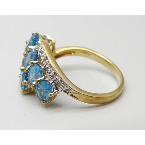 950 - A silver gilt Gemporia blue topaz with diamond accent ring, R/S