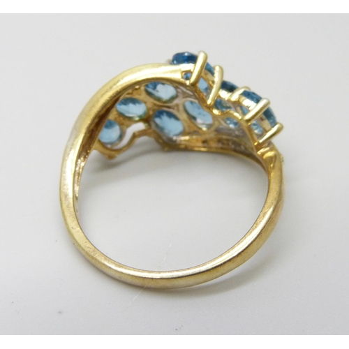 950 - A silver gilt Gemporia blue topaz with diamond accent ring, R/S