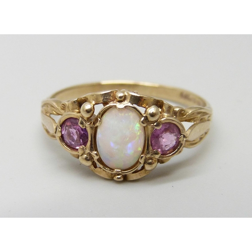 957 - A 9ct gold opal and amethyst ring, 2.9g, S