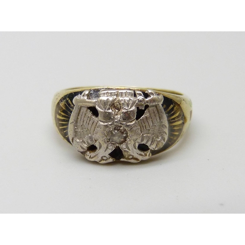 961 - A small Double Eagle Masonic ring, enamelled and set with a diamond, tests as 14k gold, 3.8g, F