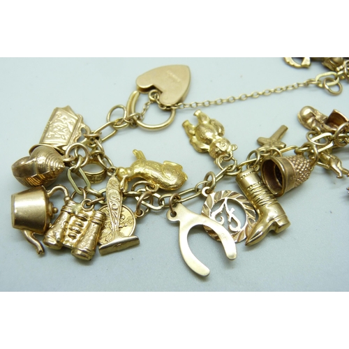 982 - A 9ct gold charm bracelet, 25.2g