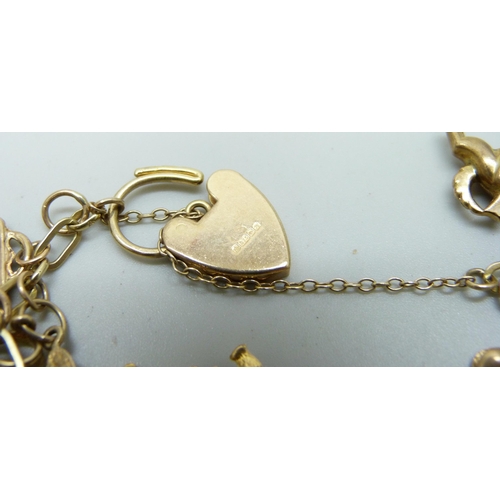 982 - A 9ct gold charm bracelet, 25.2g